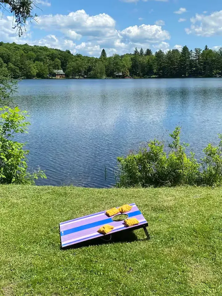 Cornhole game by the lake