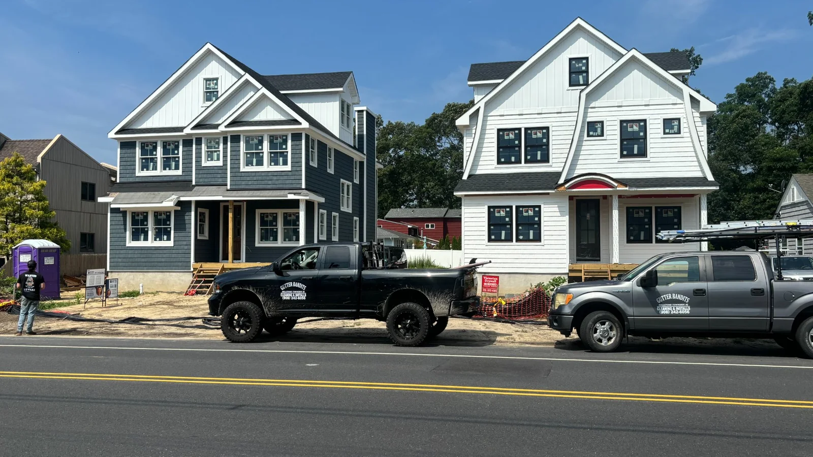 Gutter Bandits trucks at a job site in New Jersey